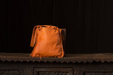 Soft Orange Leather with Brass colored Studs